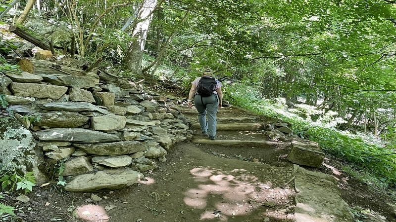 a woman hiking for weight loss by climbing stairs