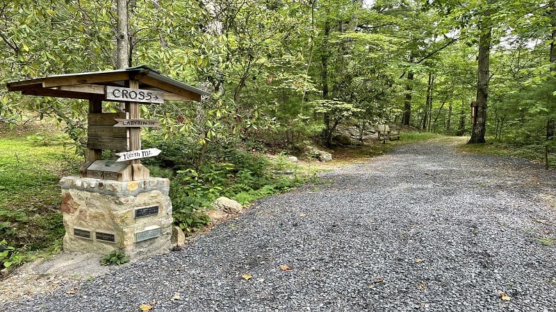 Trail sign leading to wooden cross at Shrine Mont