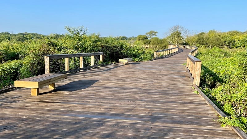 A wooden bench on the Neabsco Creek Boardwalk in Woodbridge, Virginia