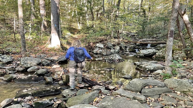 hiker at water crossing