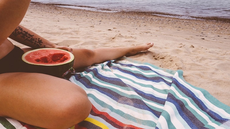 eating watermelon at the beach