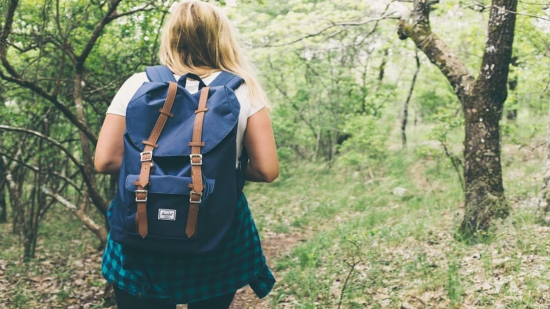 woman hiking with a backpack