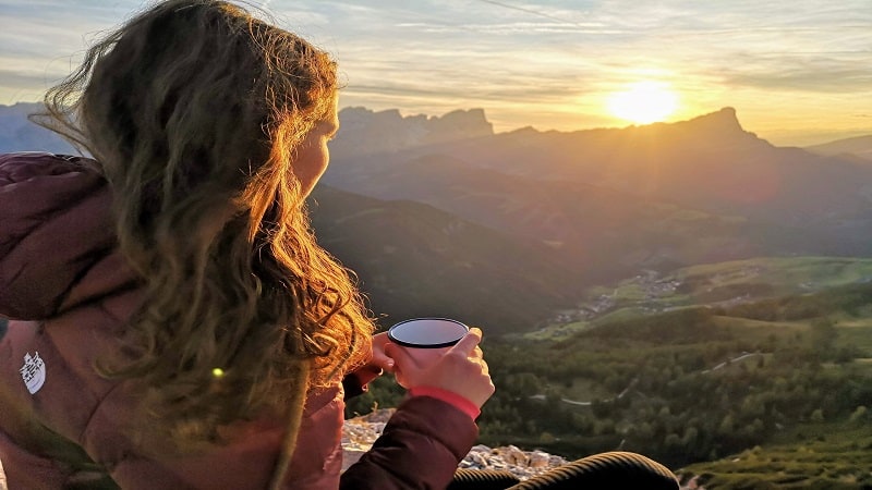 A Woman Enjoying Coffee in the Mountains