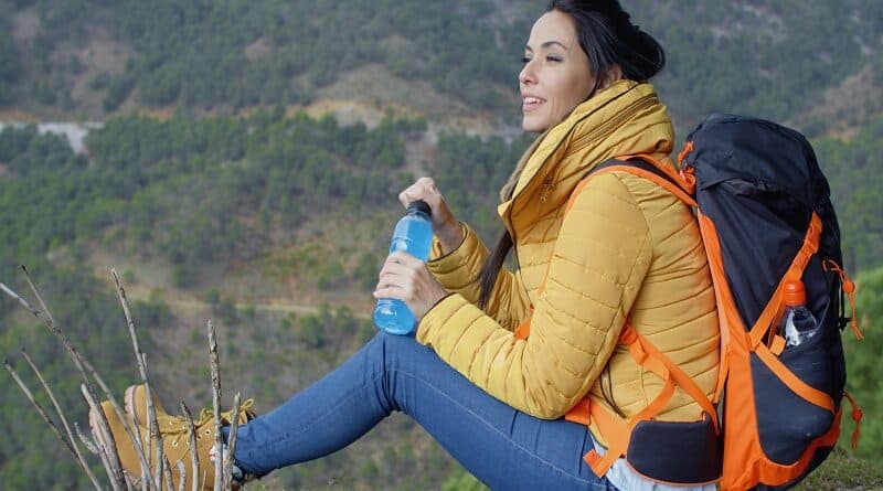 Best Electrolytes for Hiking | Backpacking Woman Drinking Sports Drink